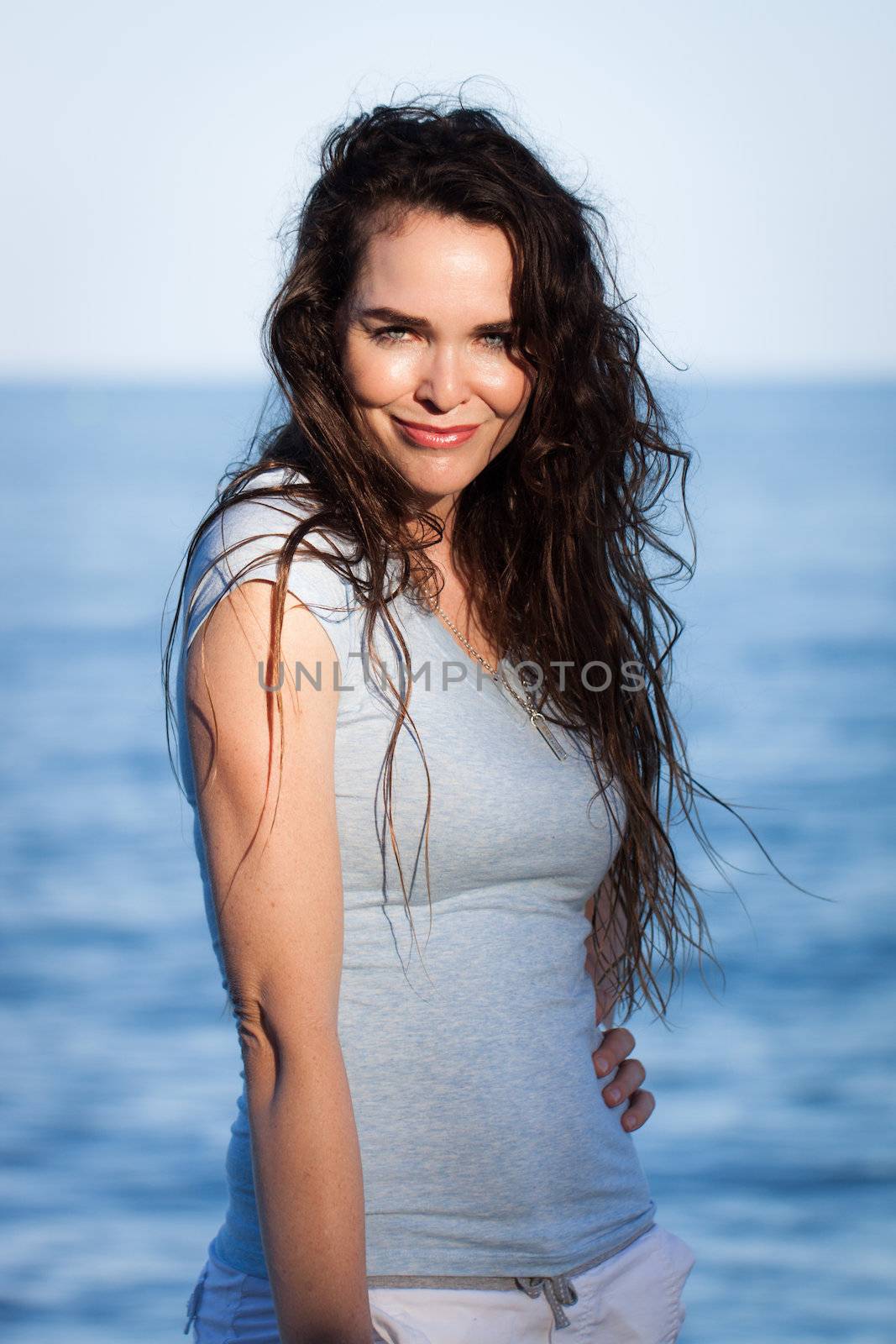 Portrait of a beautiful natural woman at the beach