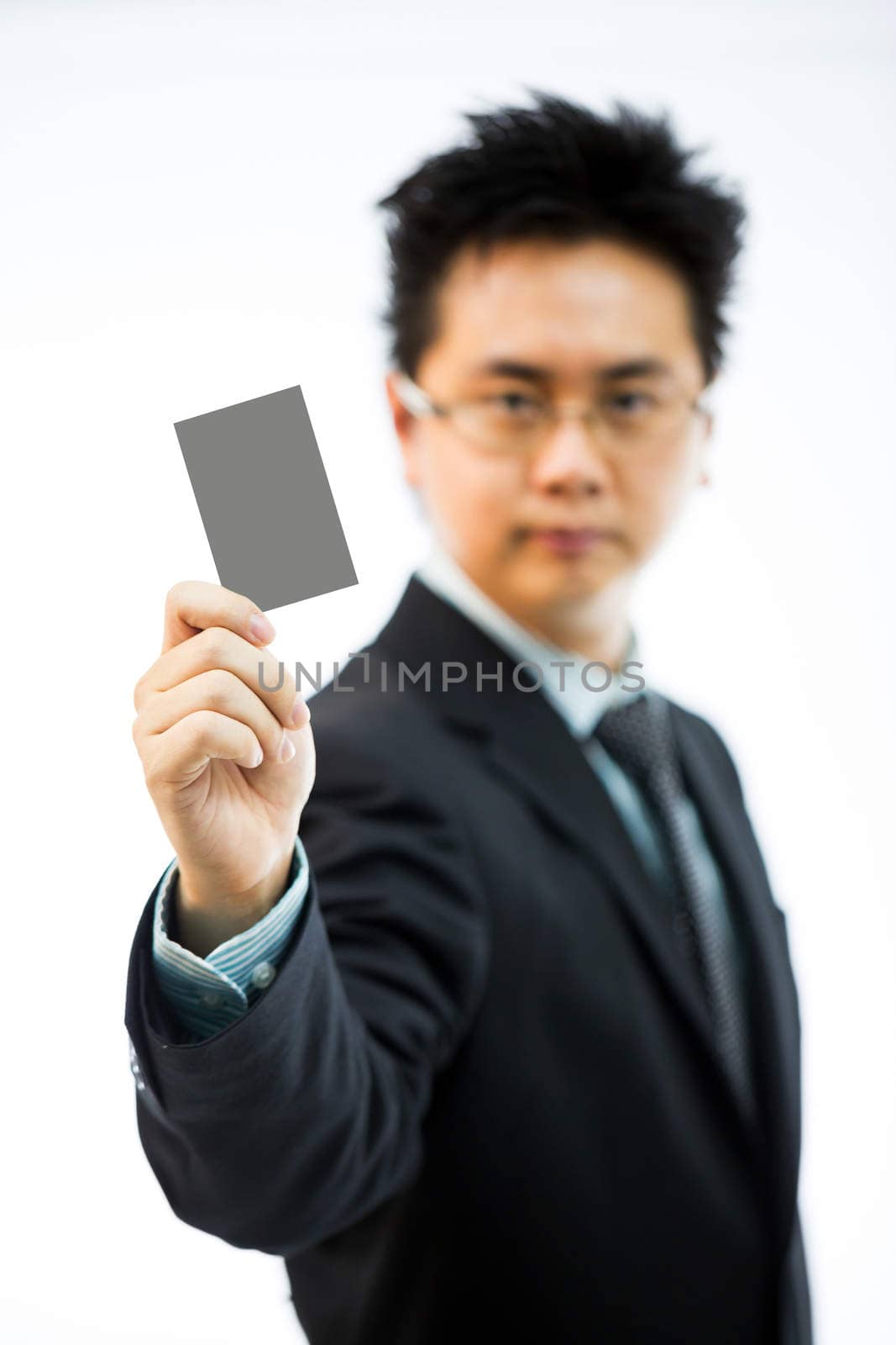 Businessman holding business name card isolated over white background (selectice focus)