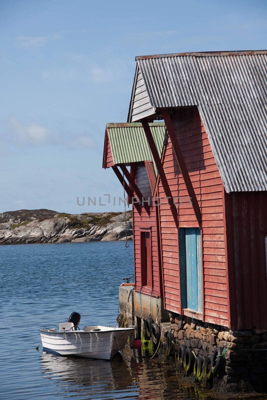 The picture shows somewhere in Norway with mountains and fjords.