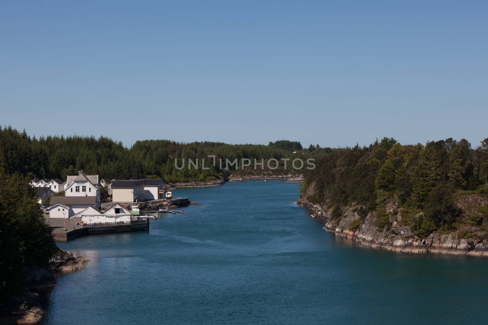 The picture shows somewhere in Norway with mountains and fjords.