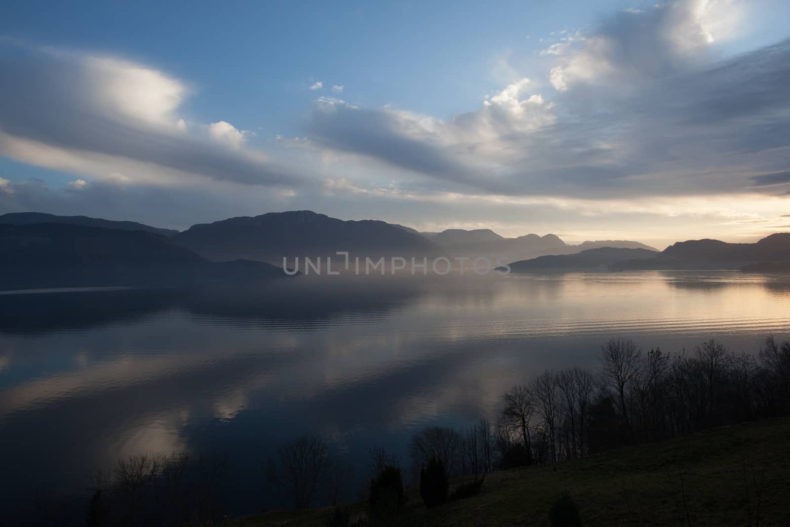 The picture shows somewhere in Norway with mountains and fjords.