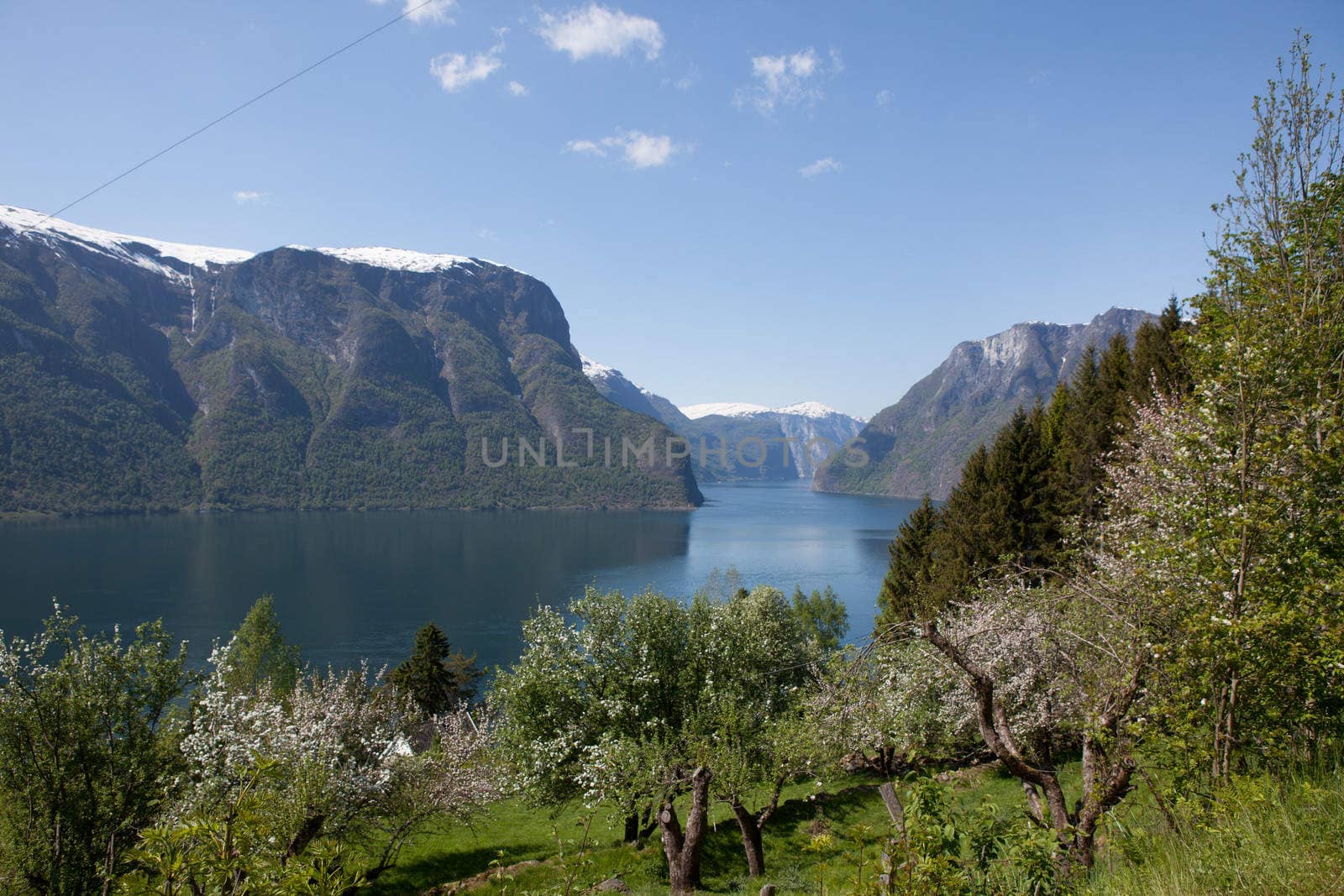 The picture shows somewhere in Norway with mountains and fjords.