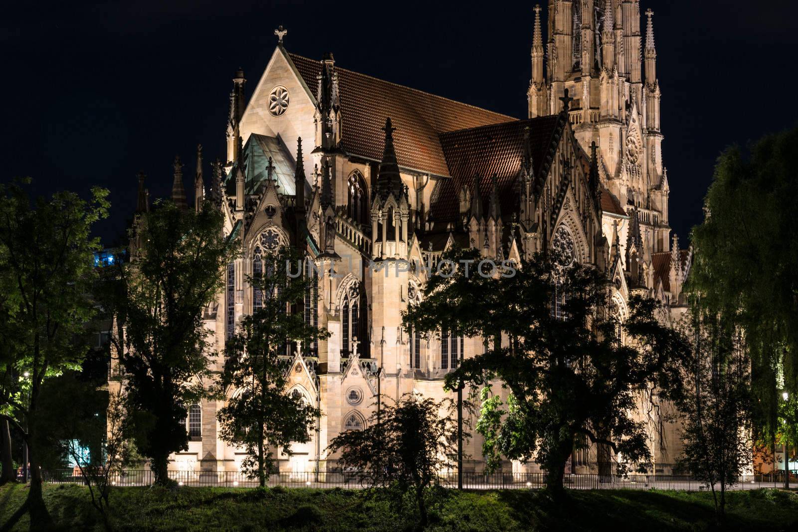 Beautiful Johanneskirche protestant church over Feuersee (Fire lake) in Stuttgart, Germany at night