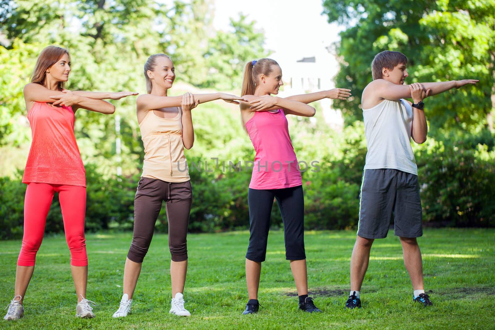 Young caucasians working out in a park by rufatjumali