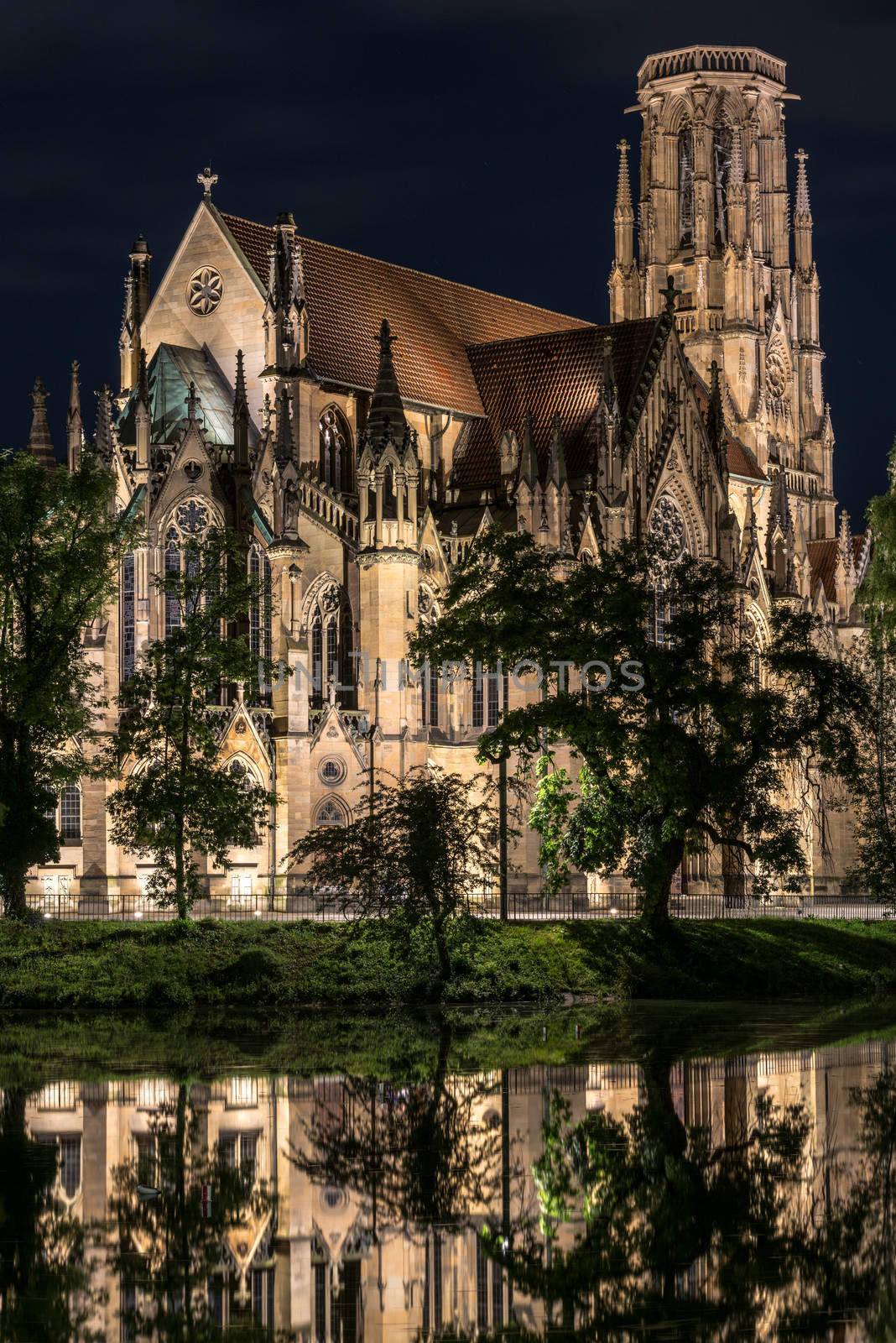 Beautiful Johanneskirche protestant church over Feuersee (Fire lake) in Stuttgart, Germany at night