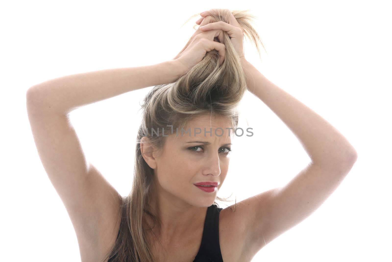 Model Released. Young Woman Styling Hair