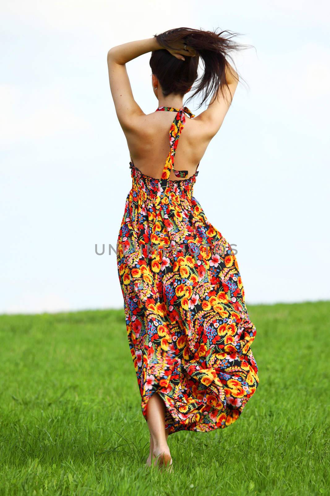 happy woman on green grass 