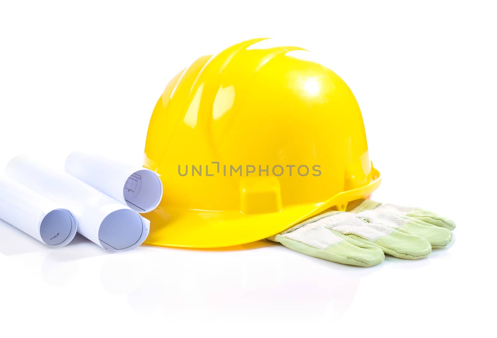 isolated yellow helmet on glove with blueprints