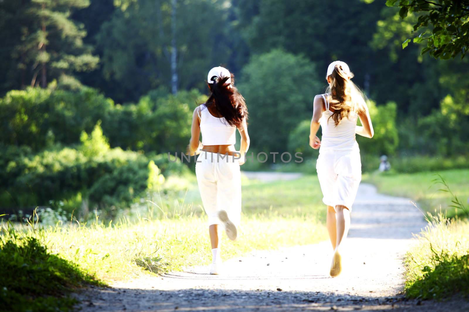 women run by sunny park alley