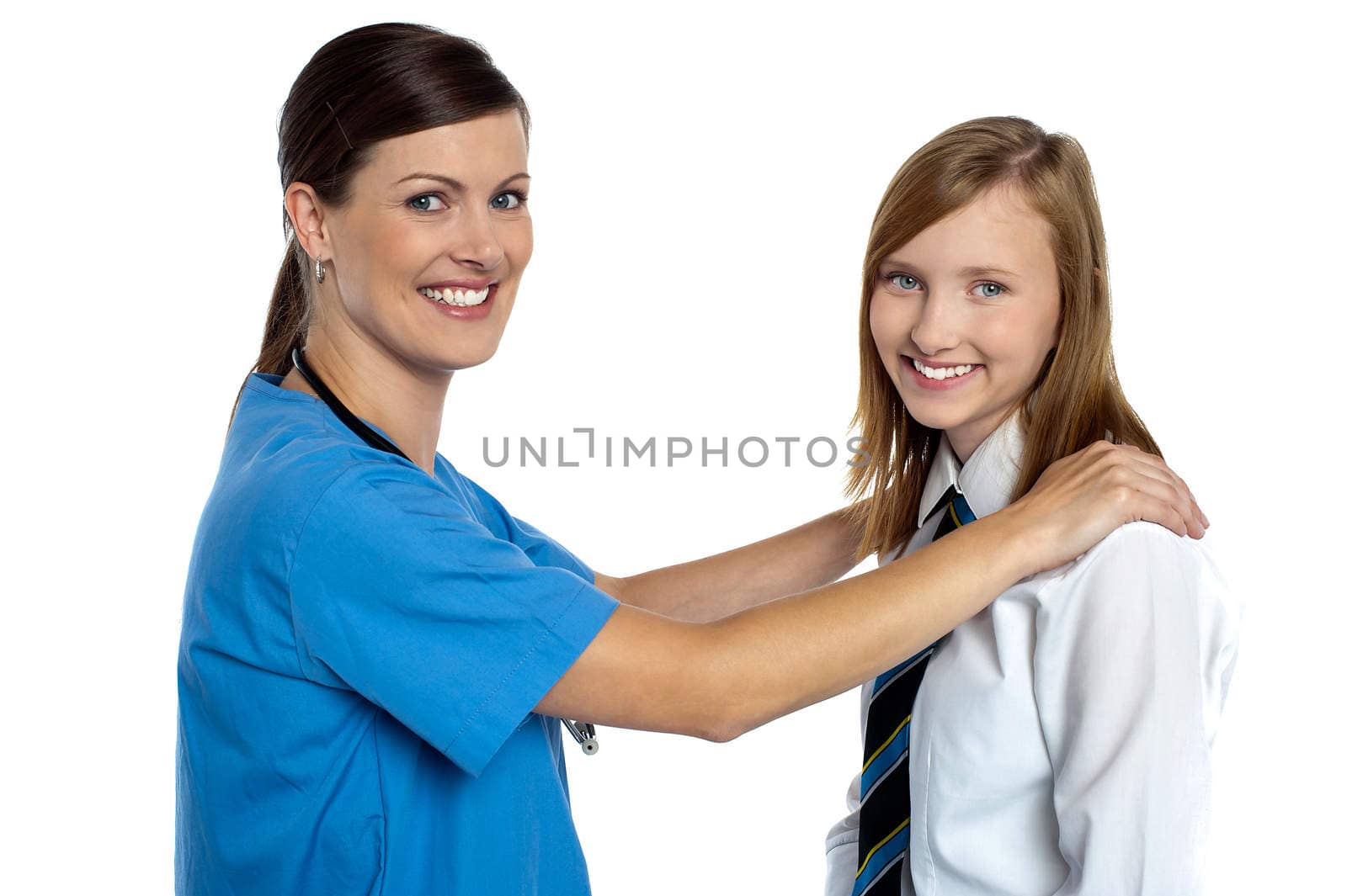 Graceful doctor posing with her teenage patient