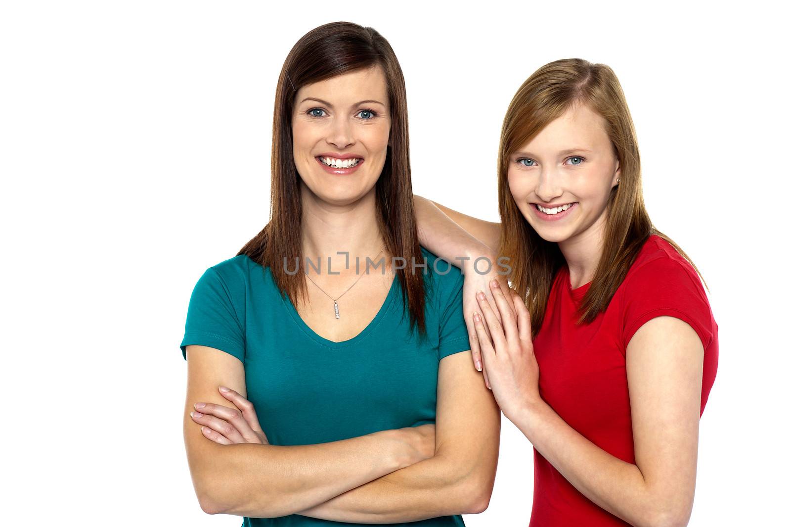 Beautiful mom and daughter posing confidently