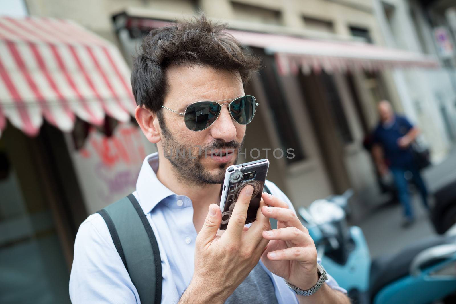 man in the street on the phone in the morning