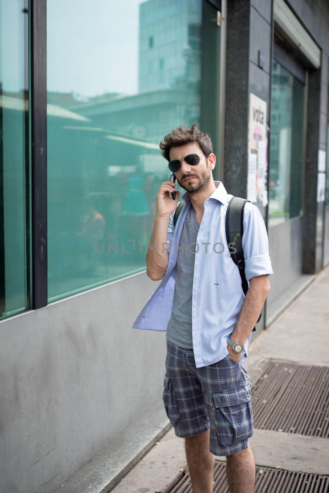 man in the street on the phone by peus