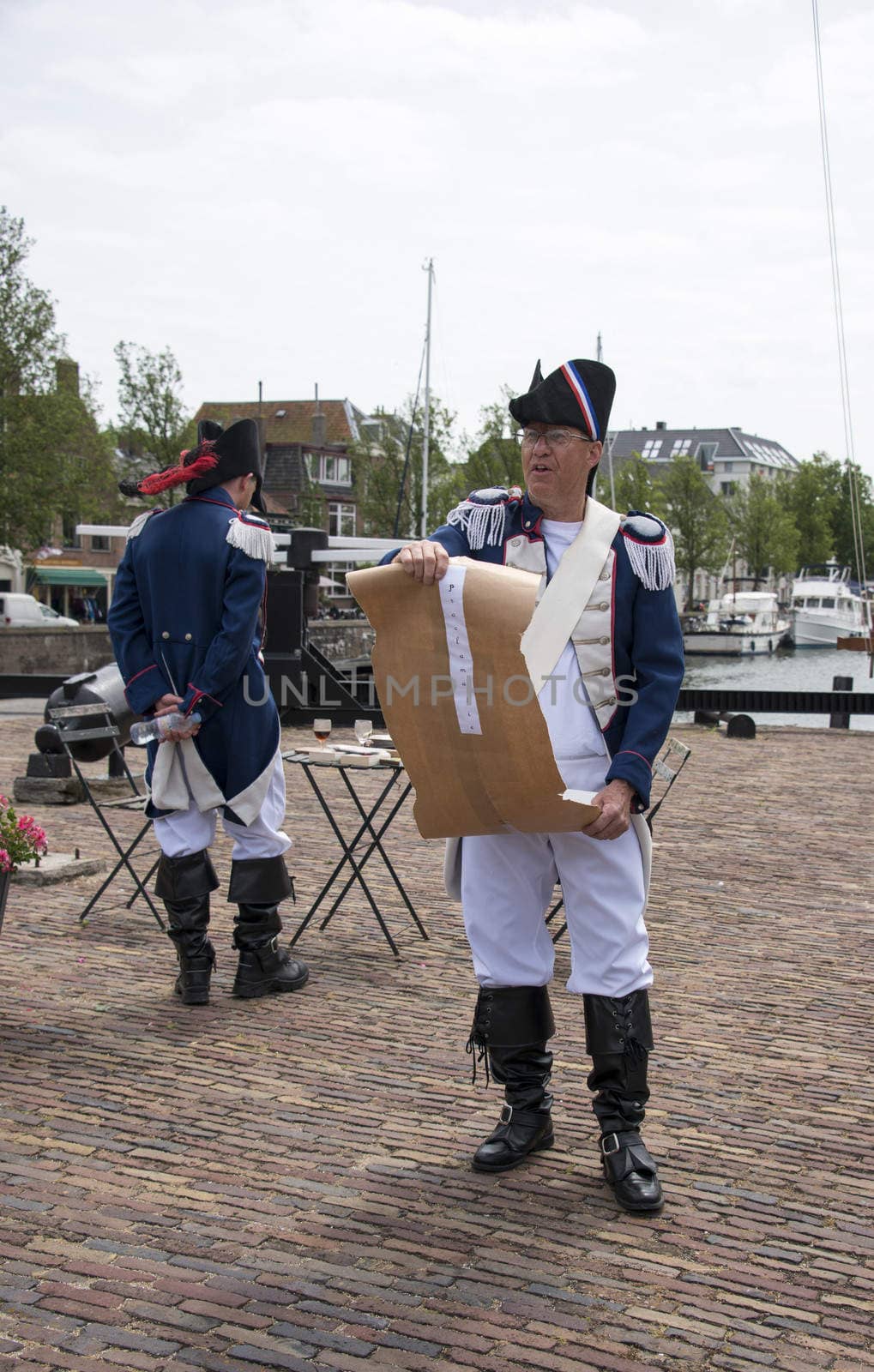 HELLEVOETSLUIS,HOLLAND - JUNE 29:Unidentified man in old france uniform as speaker to the people on the anual arts day,on June 29,2013 in Hellevoetsluis, Holland.This days is once a year to introduce art and culture