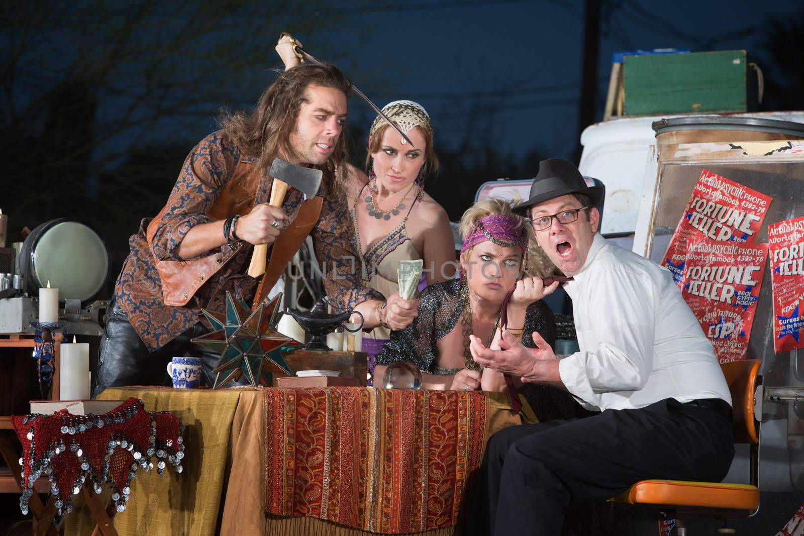 Scared fortune teller customer threatened with weapons