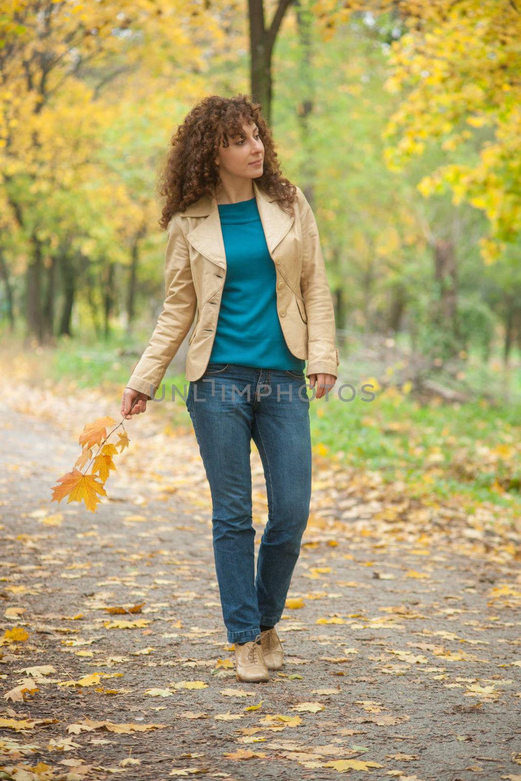 Beautifull girl walk in autumn park