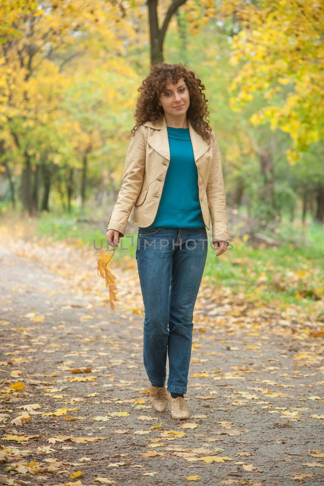 Beautifull girl walk in autumn park