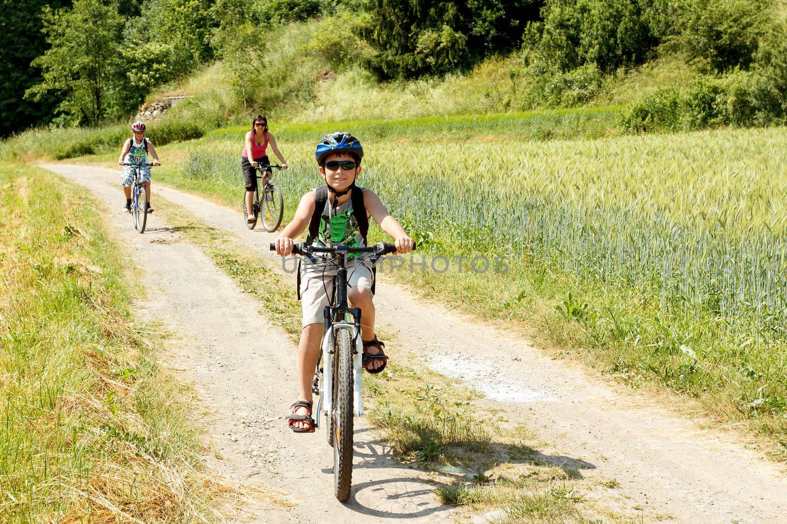 Teenager riding bicycle on trip in sunny day