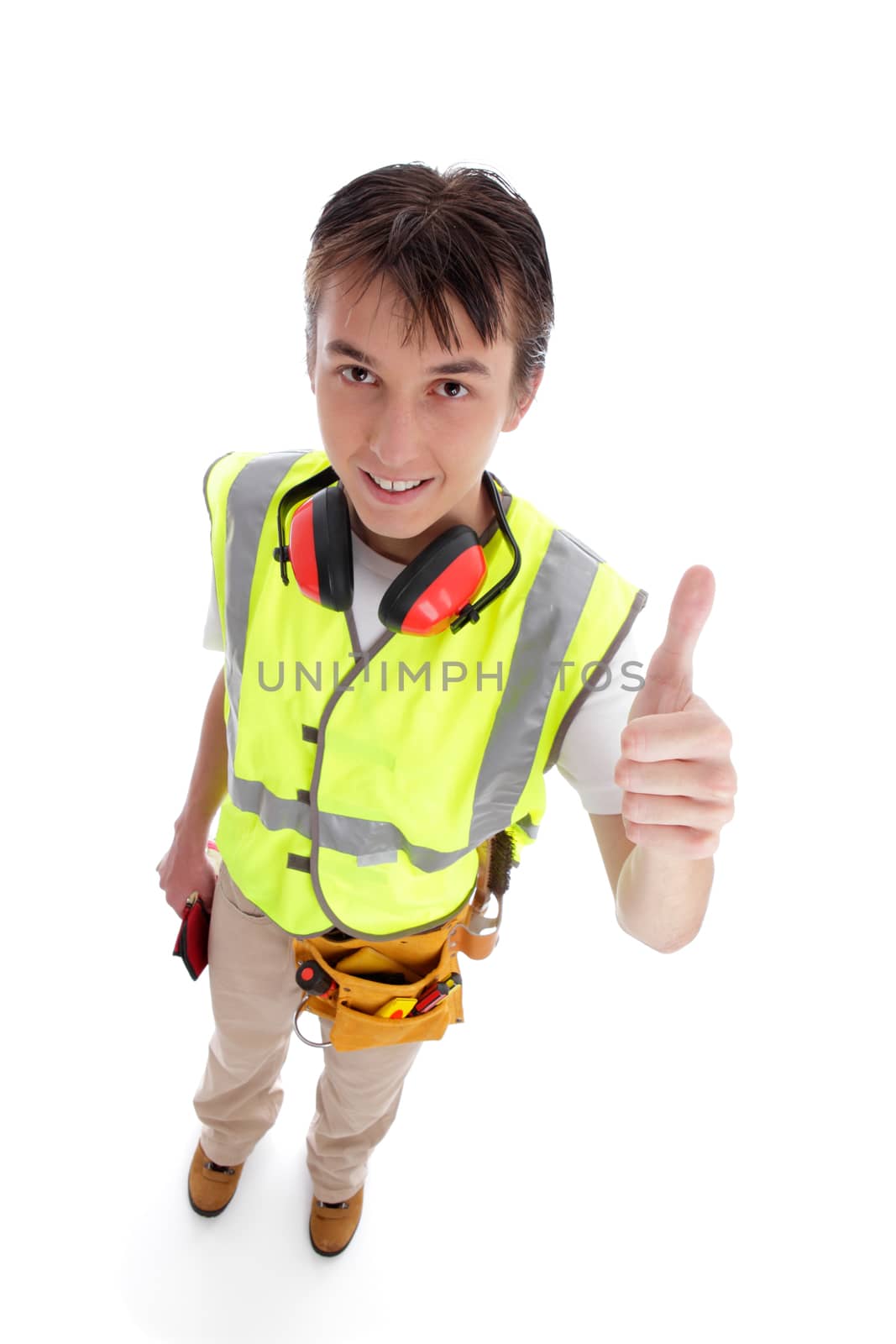 Smiling apprentice builder thumbs up.  White background.