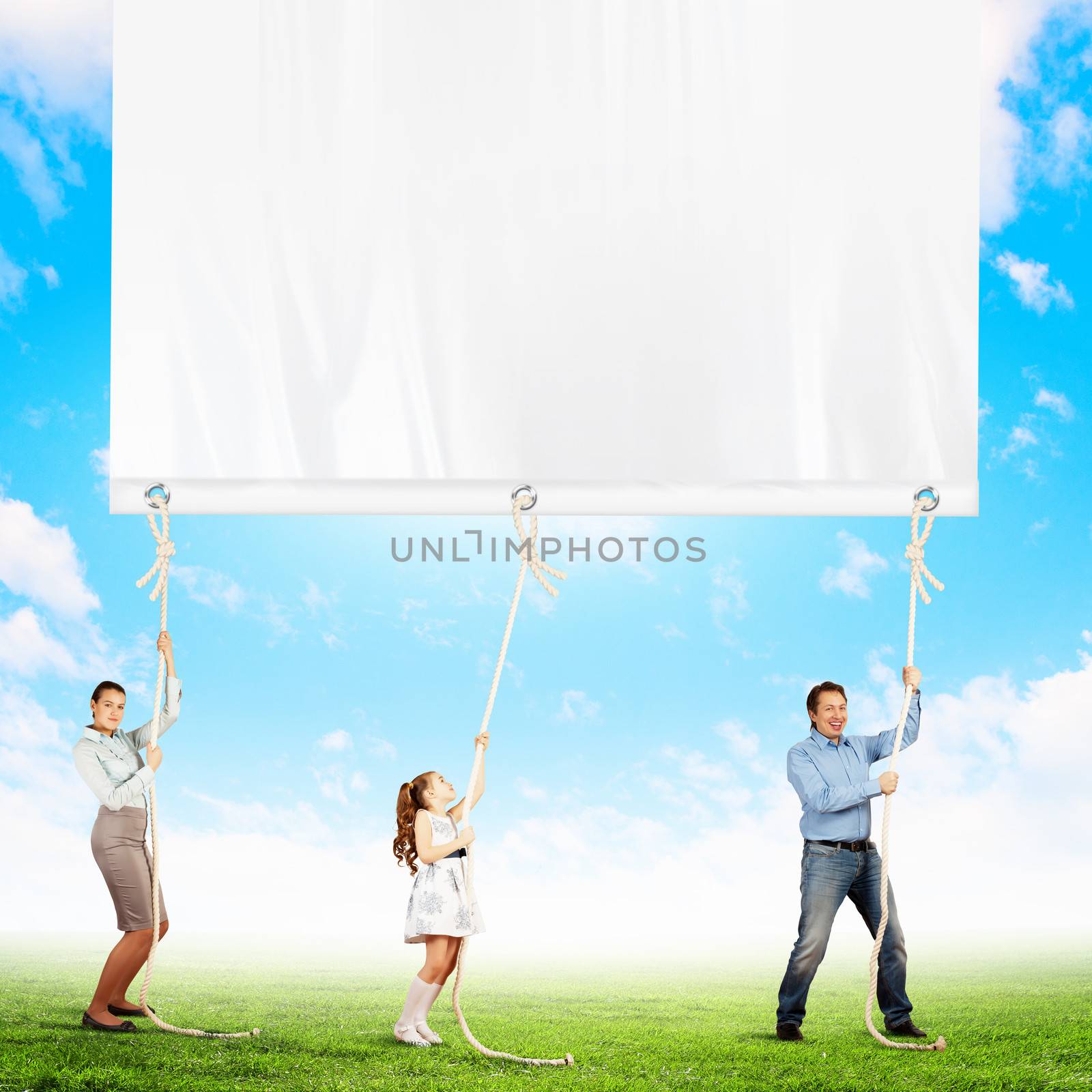 Happy family pulling banner. Place for text