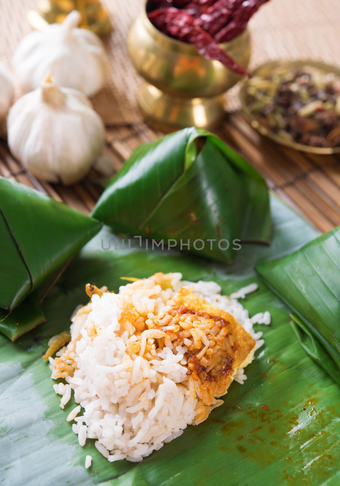 Nasi lemak Malay dish, popular traditional Malaysian food wrapped with banana leaf.
