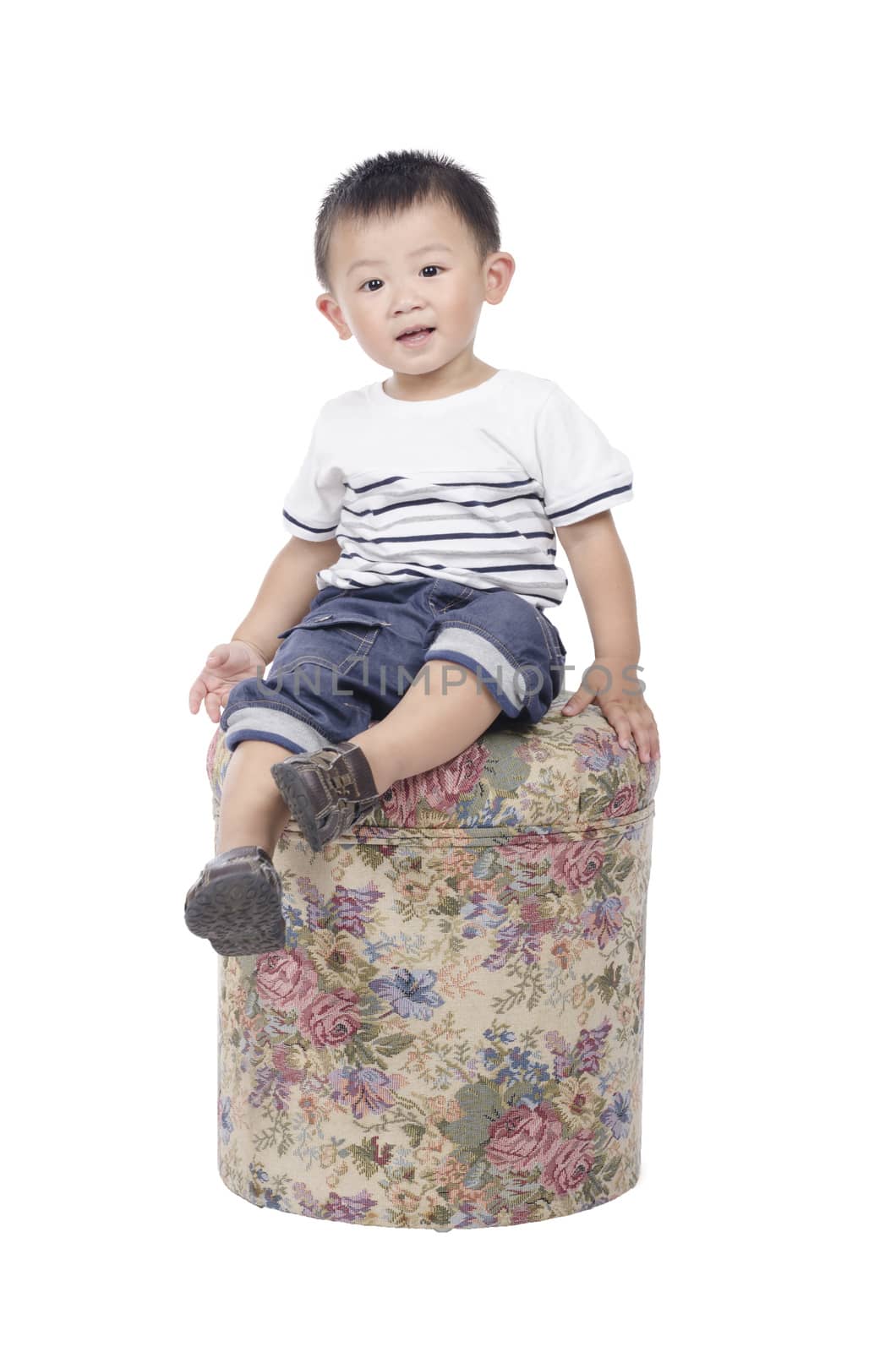 Boy sitting on chair