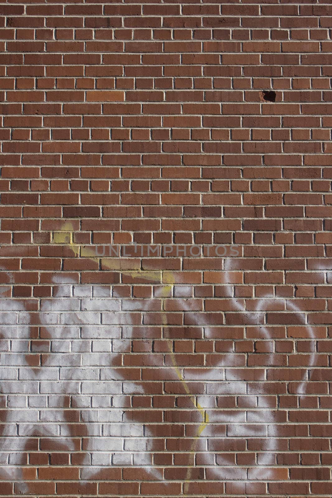 Large brick wall with graffiti by jeremywhat
