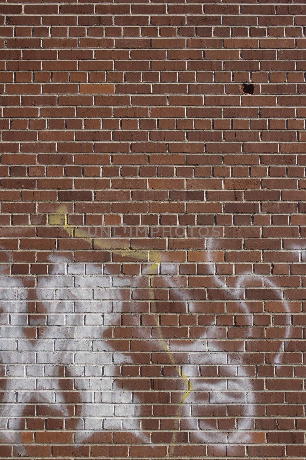 an old brick wall with graffiti