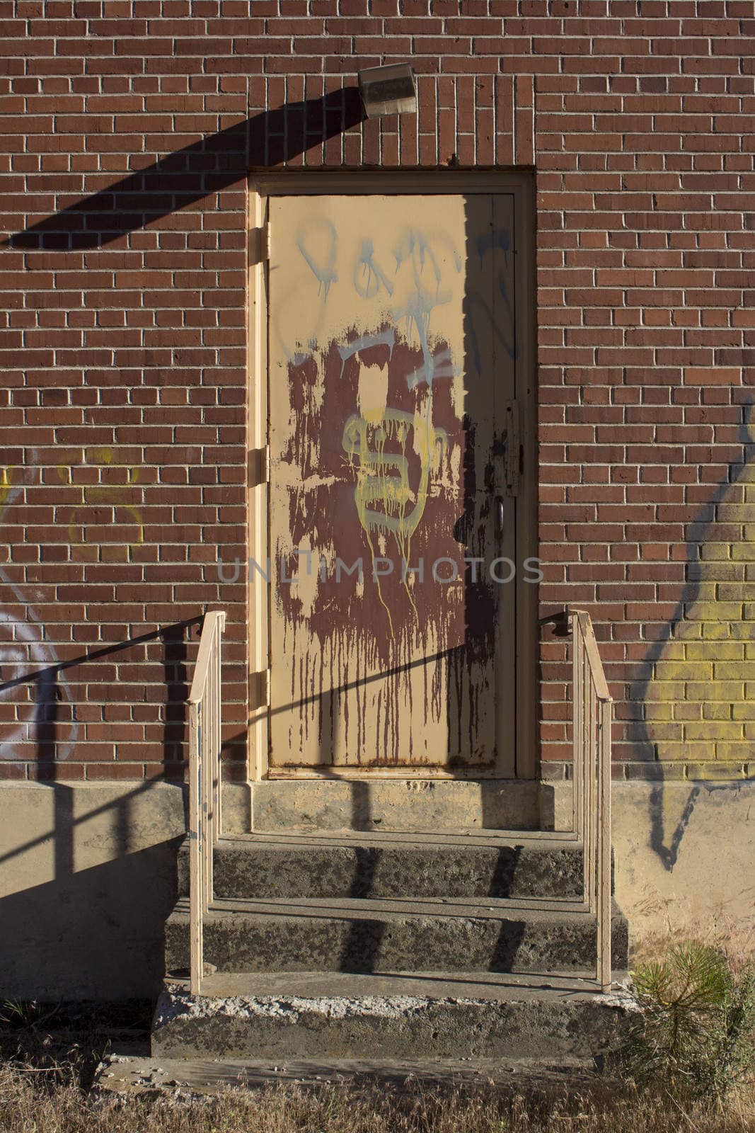 Old brick house door graffiti by jeremywhat