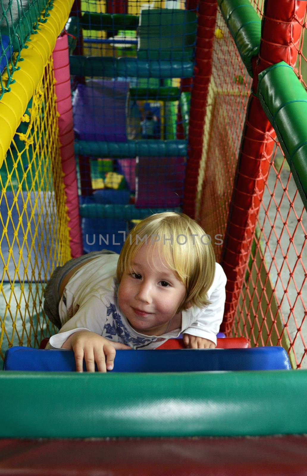 happy child playing in the children's play center