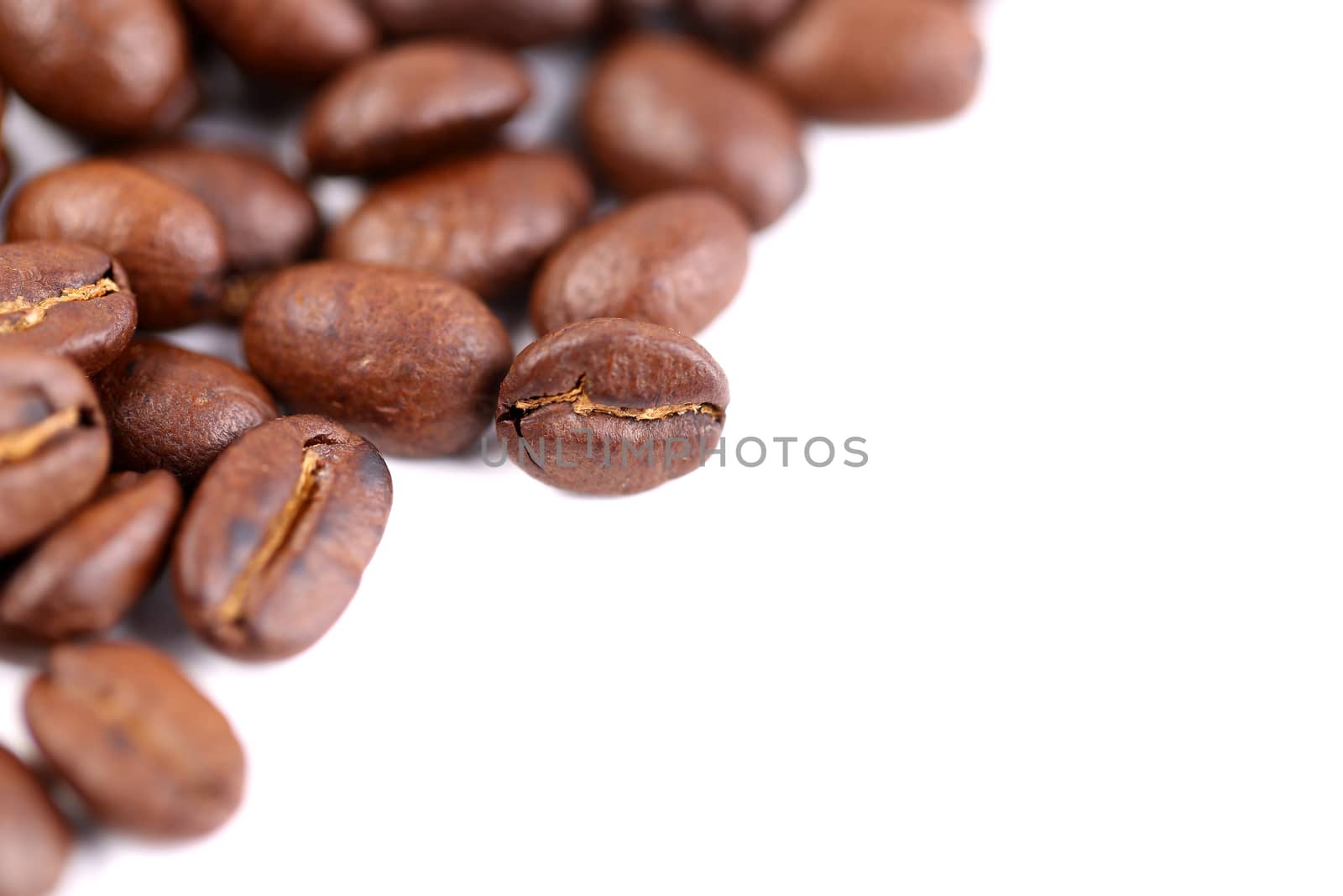 roasted coffee beans are located left on the white background