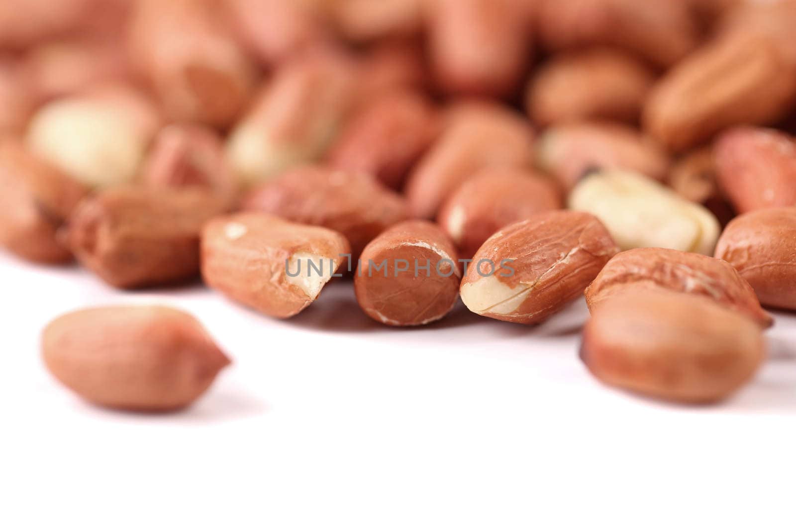 Extreme close-up image of peanuts on the white background