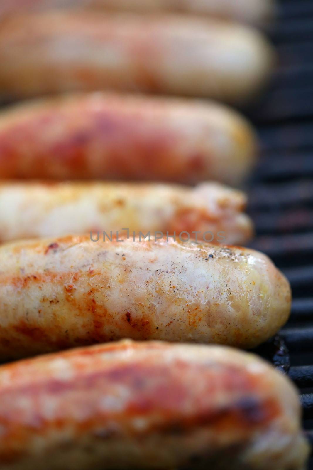 Delicious german sausages on the barbecue grill by indigolotos