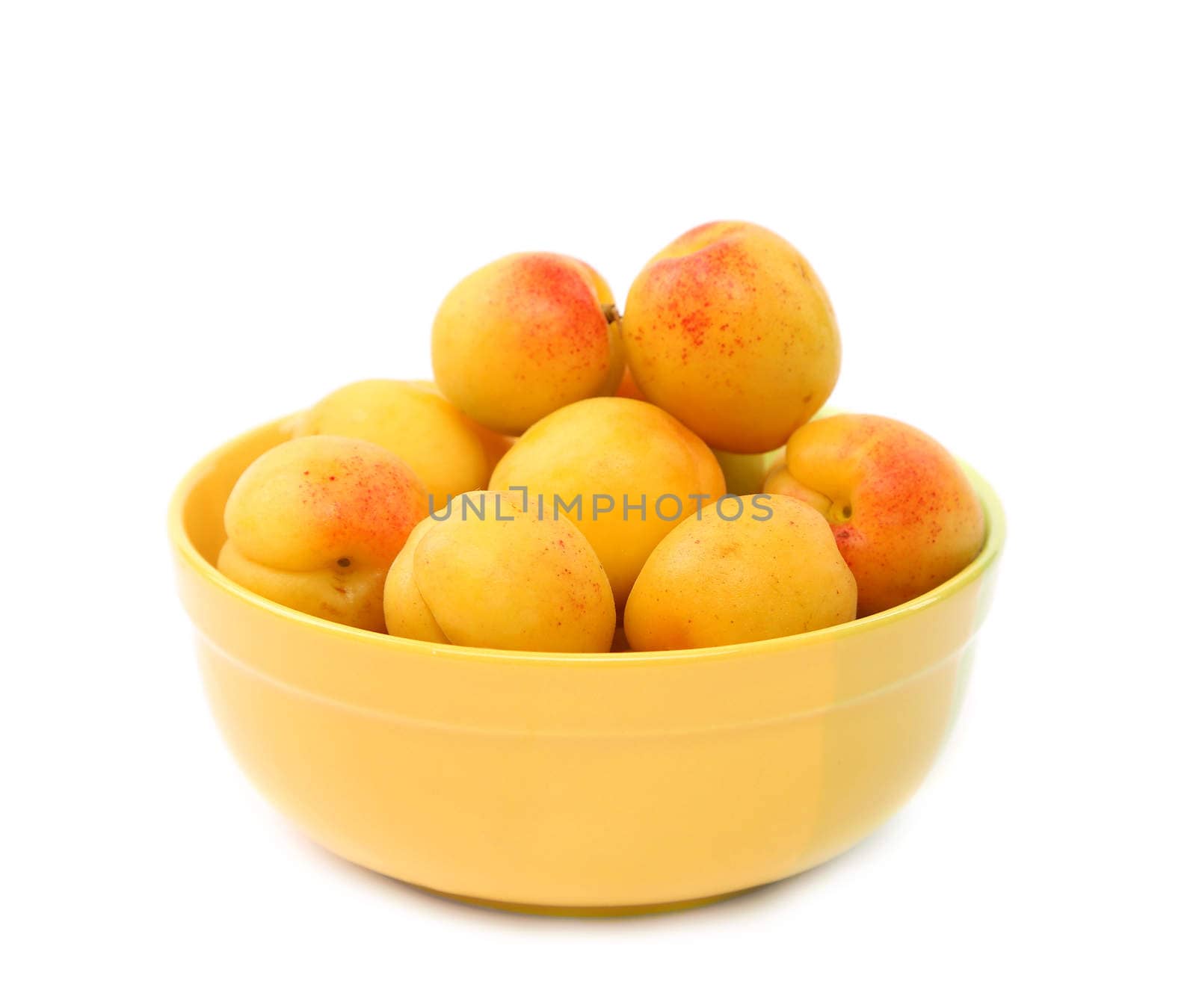 A fresh apricots in the bowl by indigolotos