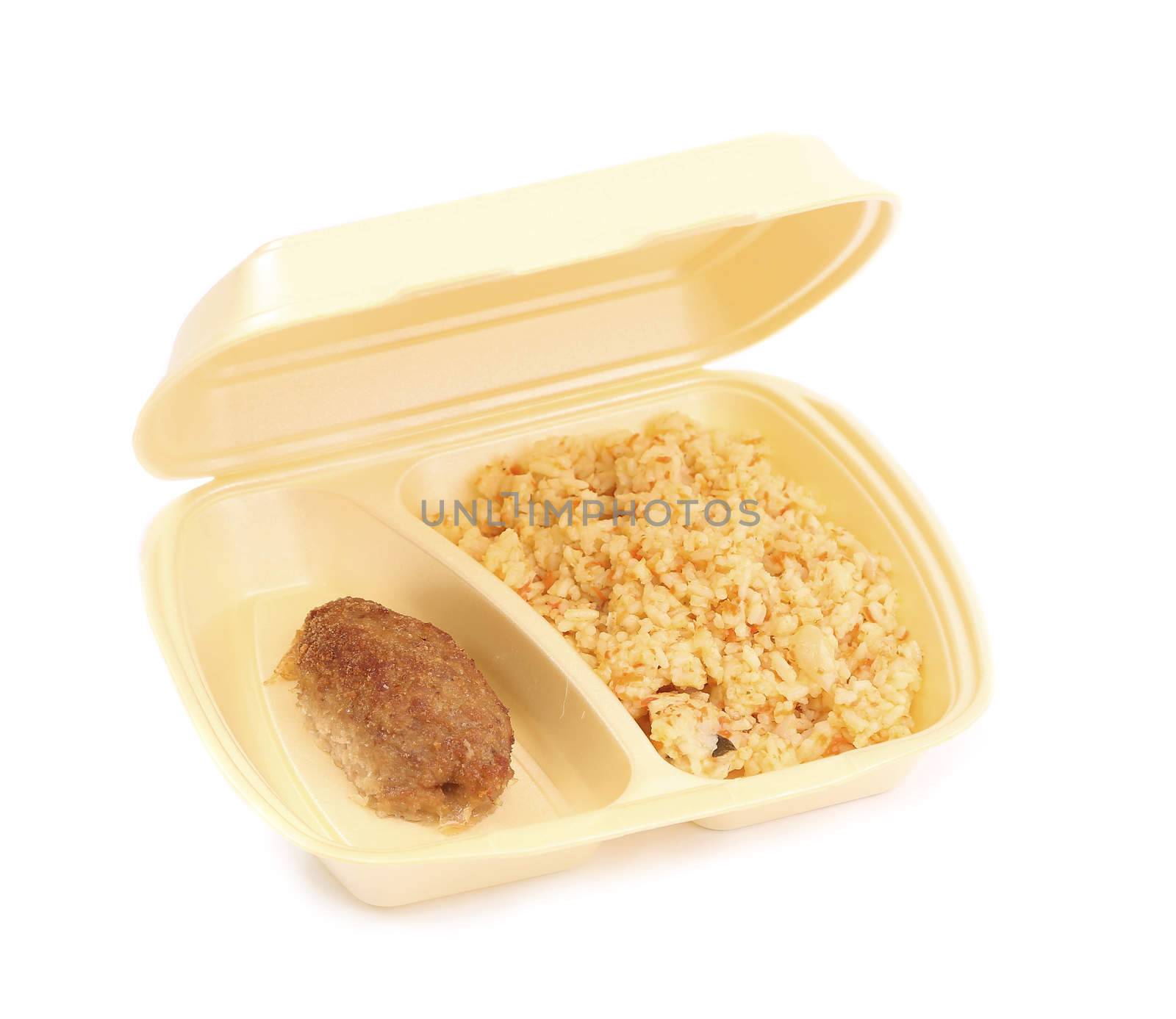 meat rissoles with rice in food container on a white background