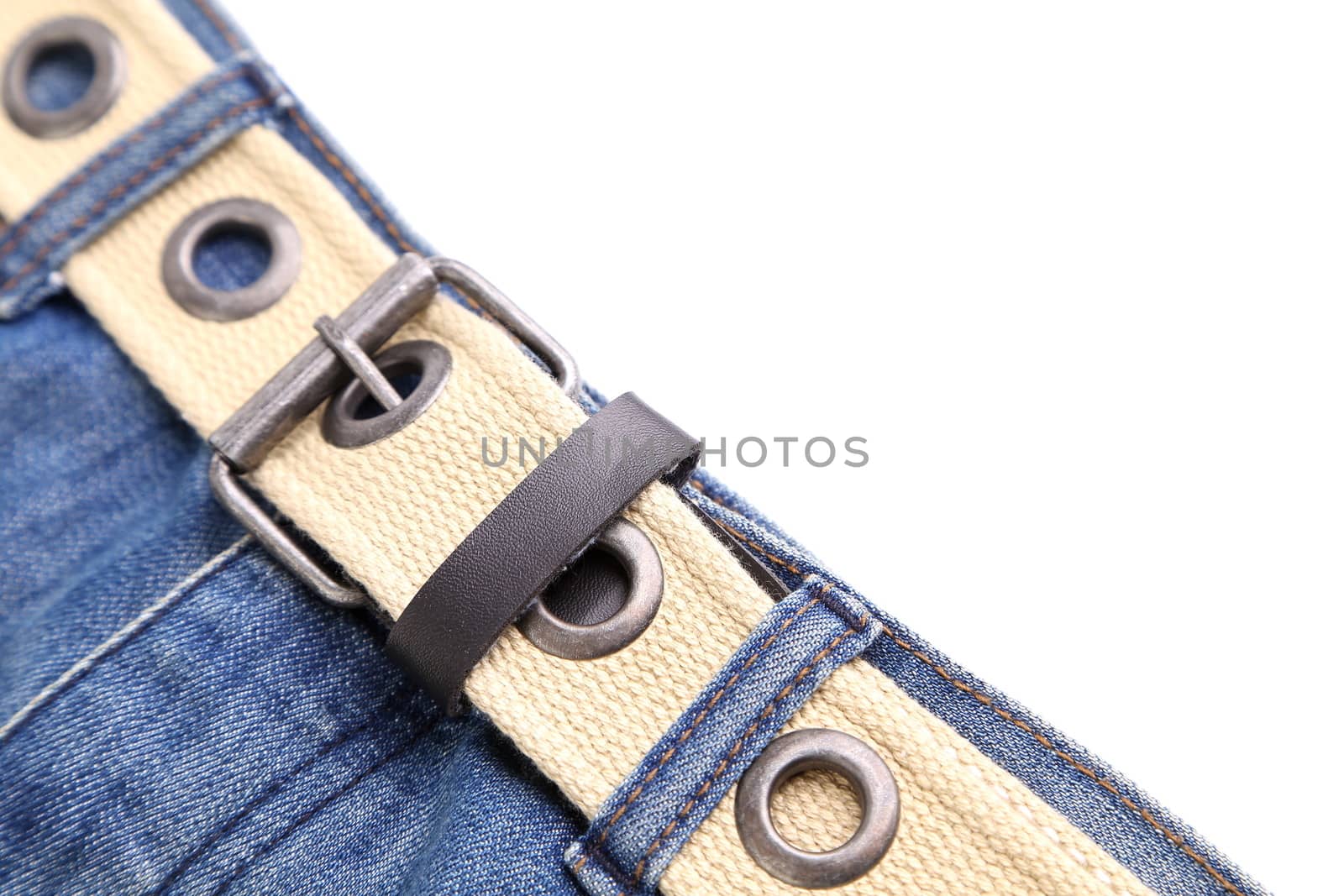 Frame. Jeans and belt. A half frame is located a white background.