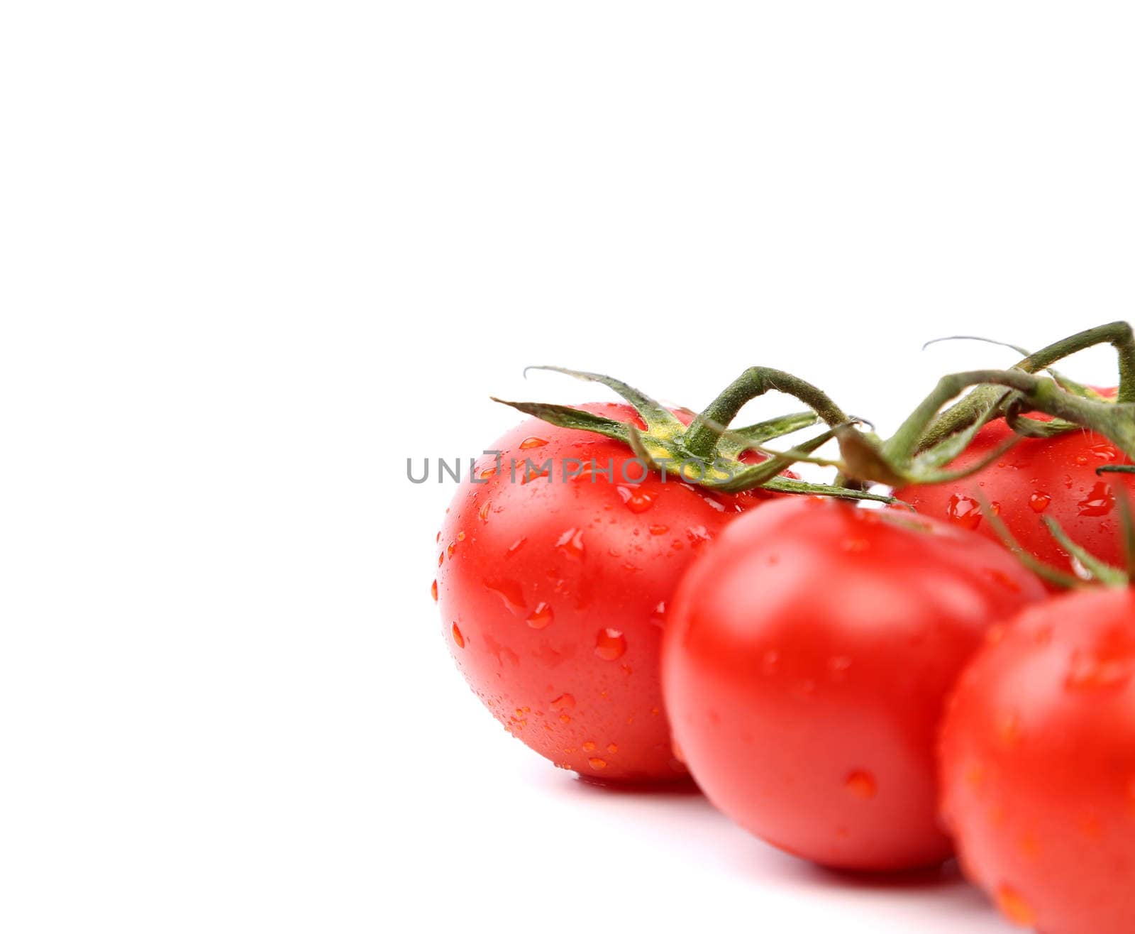 bright red tomatoes isolated on a white background