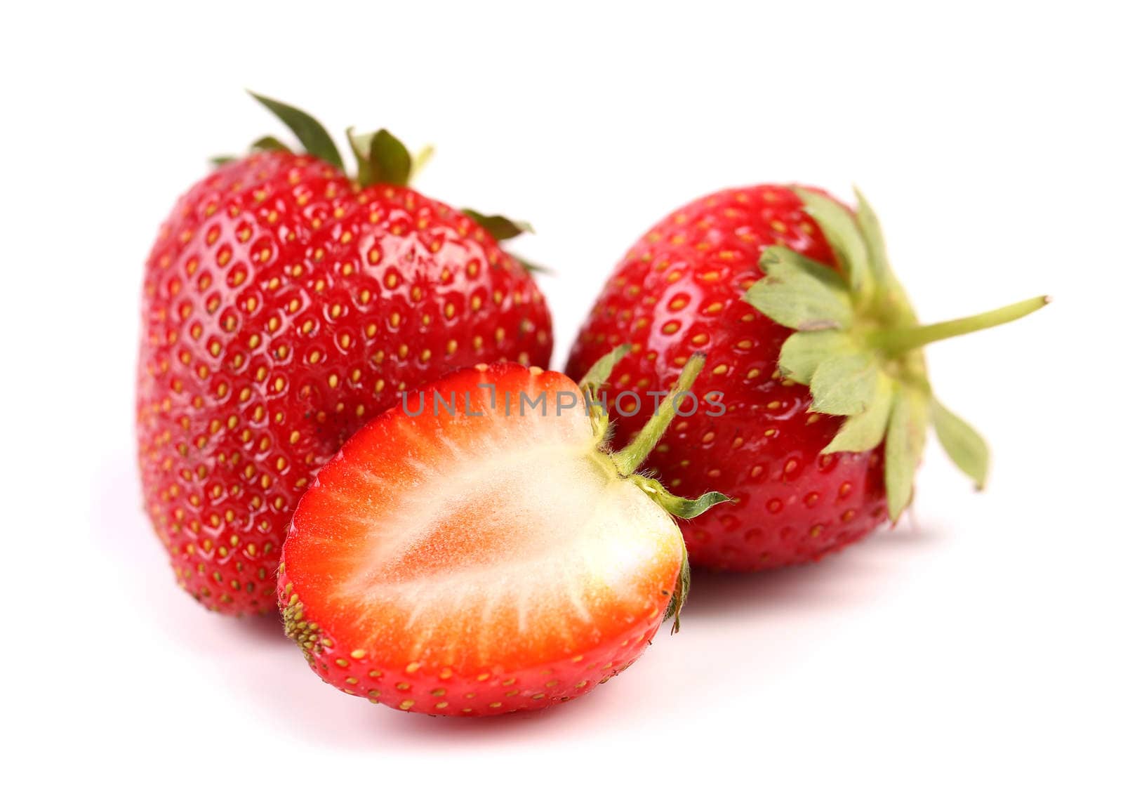 strawberries two and half isolated on white