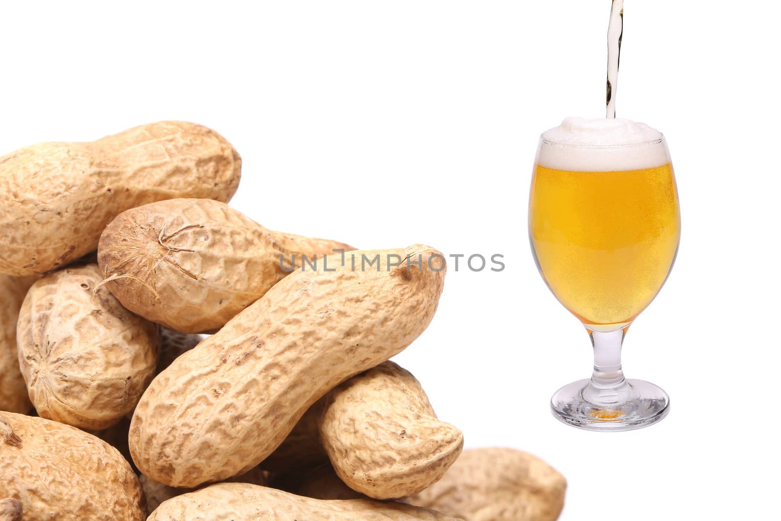 Stream, glass of beer and peanuts on a white background