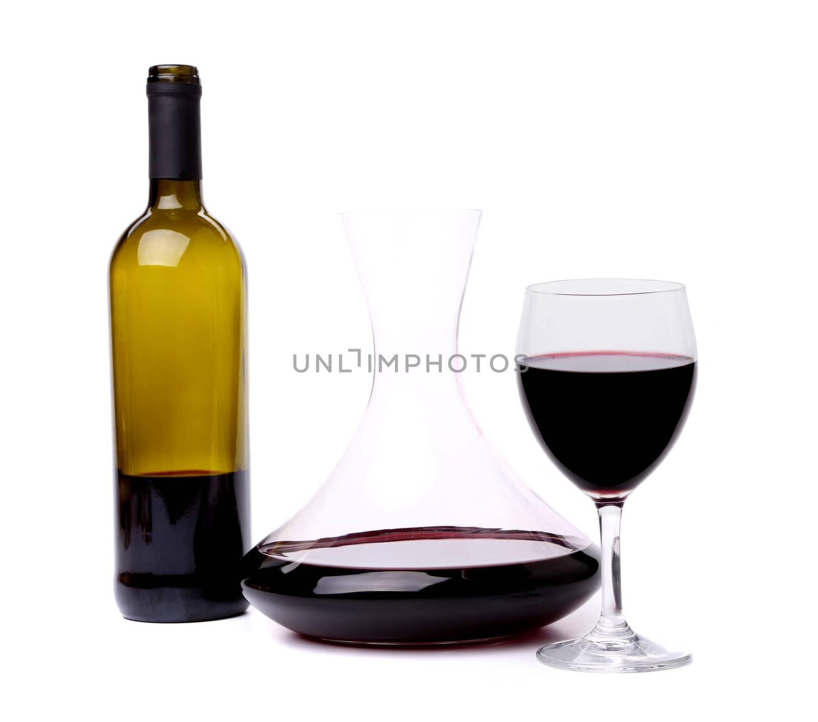 glass and bottle of red wine decanter