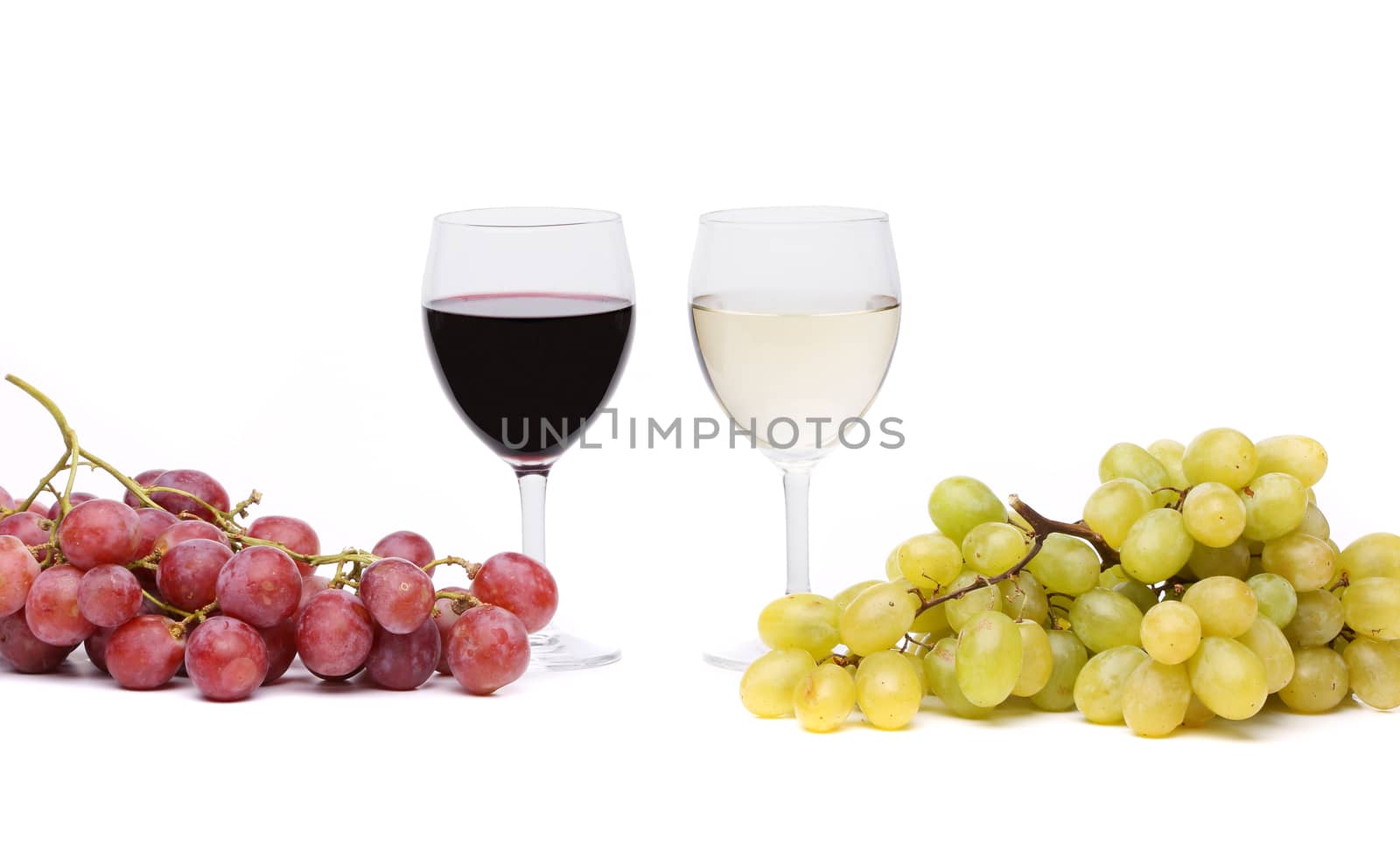 glasses of wine and ripe grapes isolated on white
