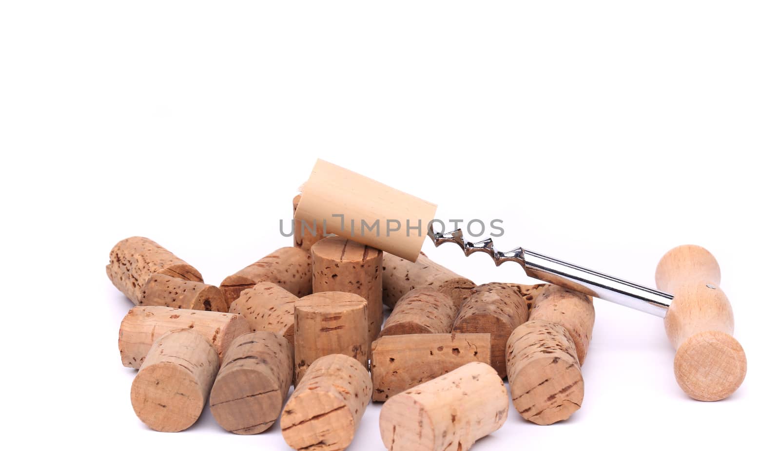 Corkscrew and wine corks on awhite background
