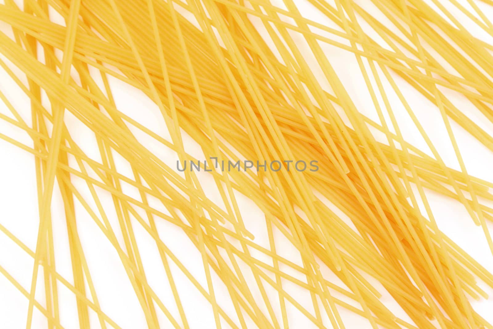 Uncooked italian spaghetti mesh on a white background