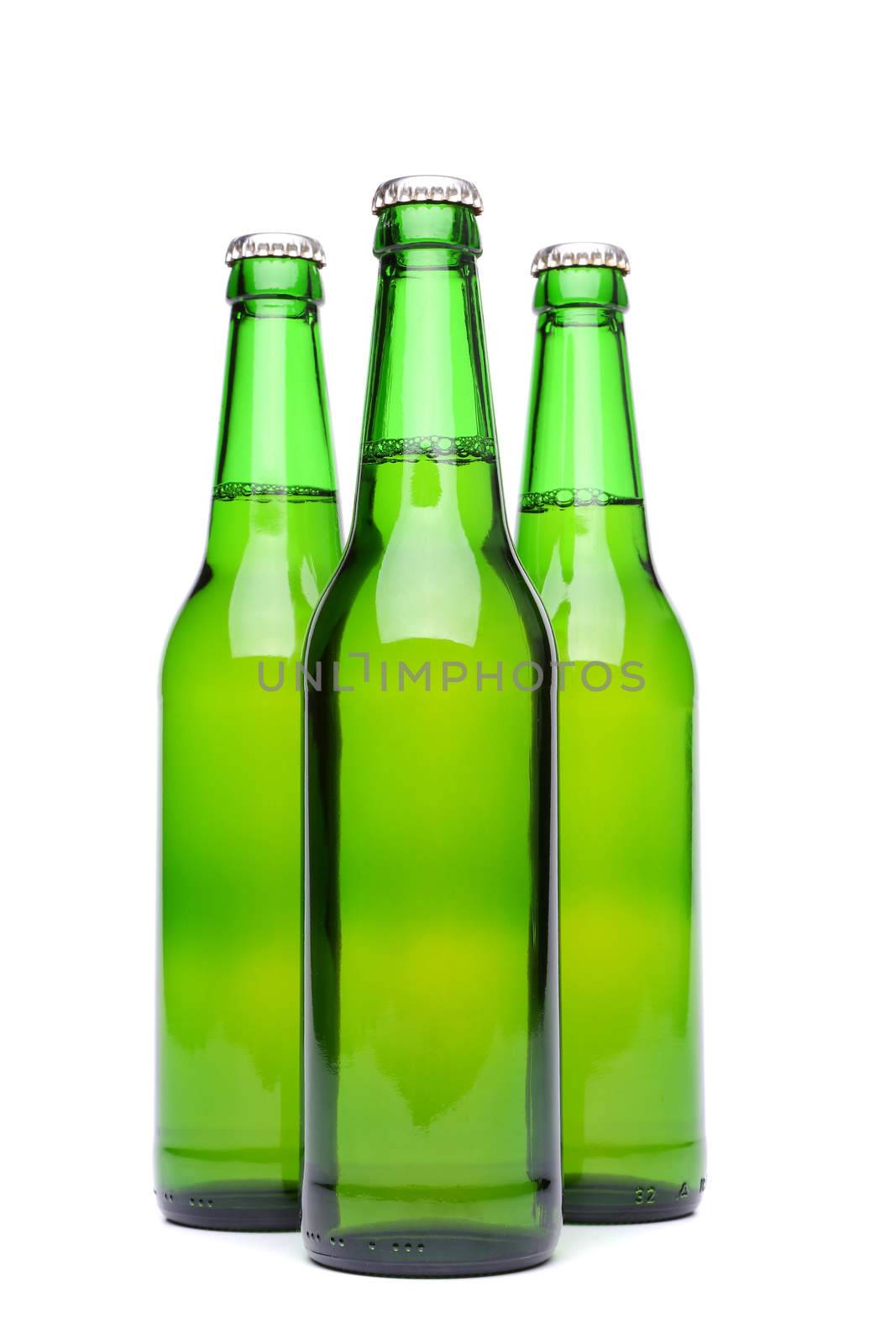 Three green beer bottles. Isolated on white background