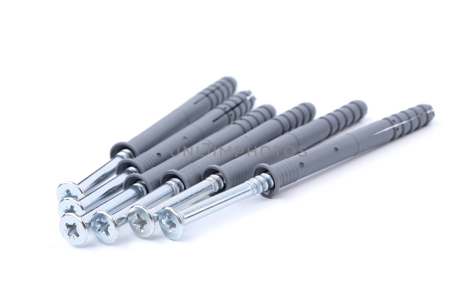 Screws and dowels isolated on white background