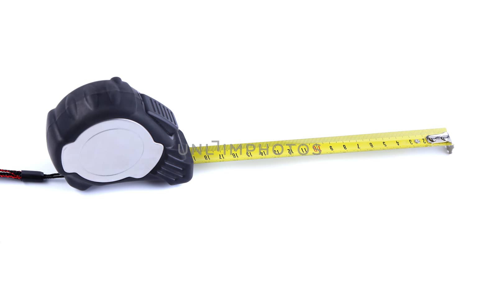 Tape measure isolatedis located left on the white background