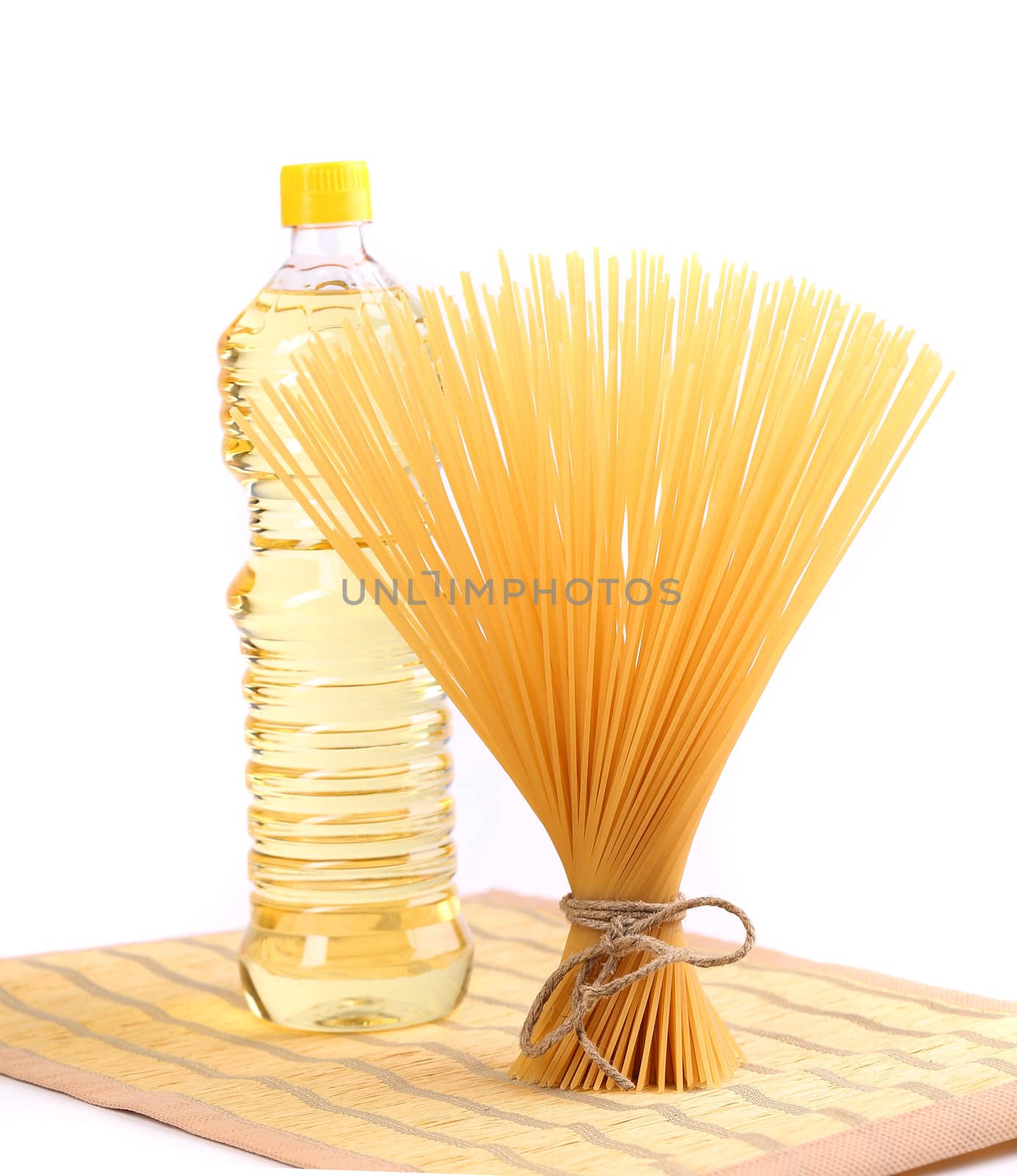 bunch spaghetti, oil, on a table-napkin. A white background.