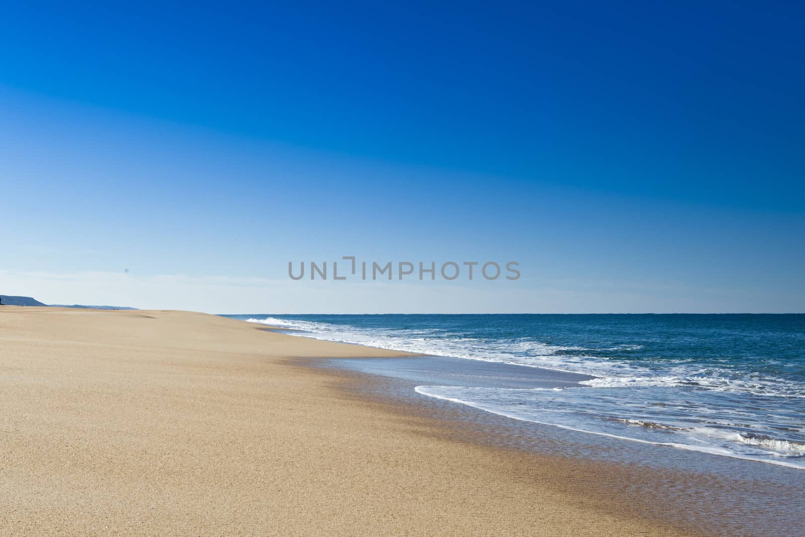 Beautiful landscape of a white sand beach from south europe