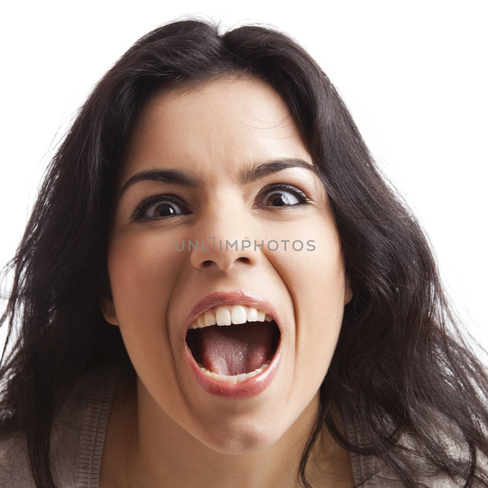 Portrait of a  young woman with a crazy expresion, isolated over white background