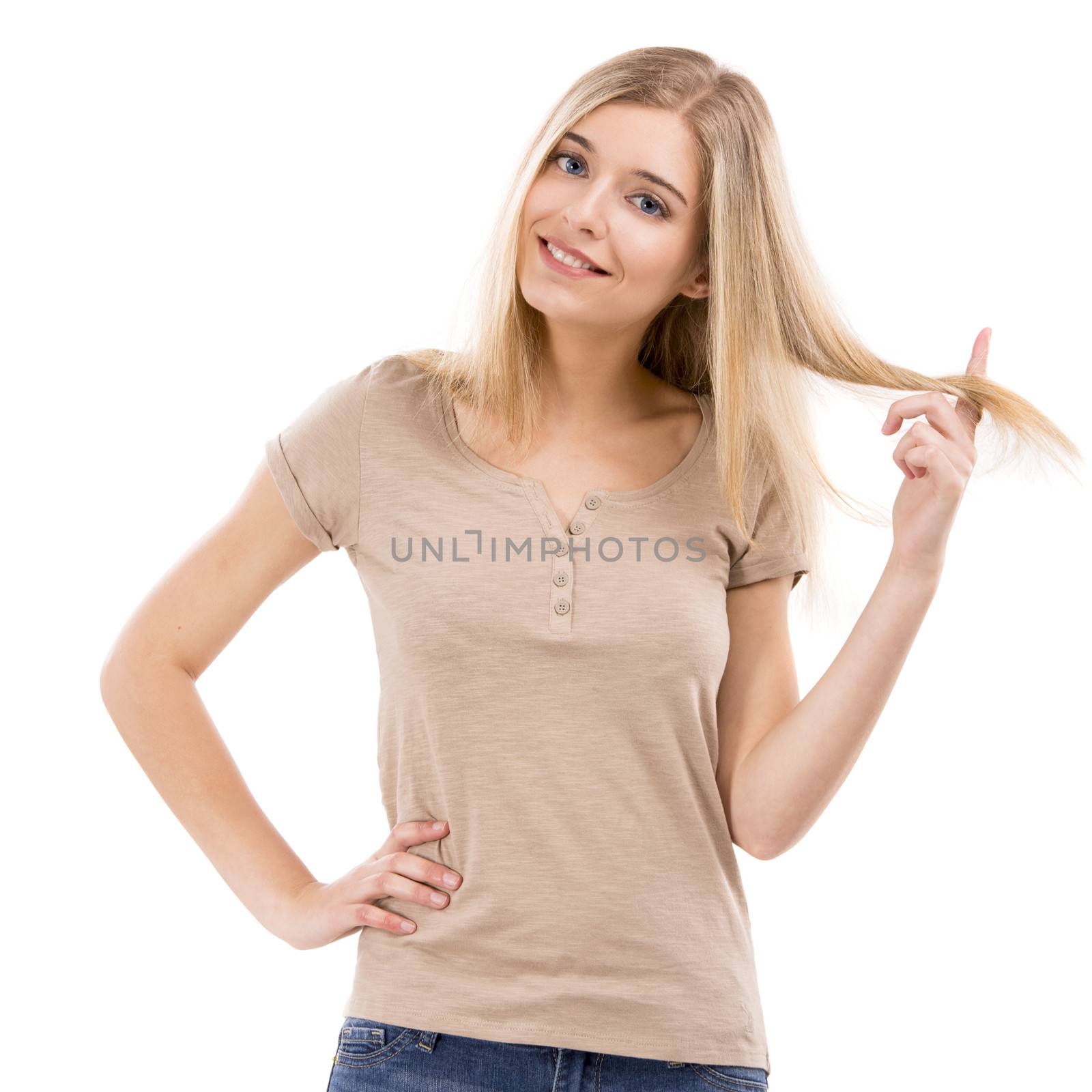 Beautiful blonde woman smiling and touching her hair, isolated over white background